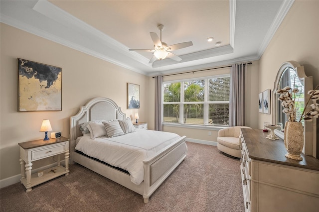 bedroom featuring ornamental molding, a raised ceiling, ceiling fan, and carpet flooring