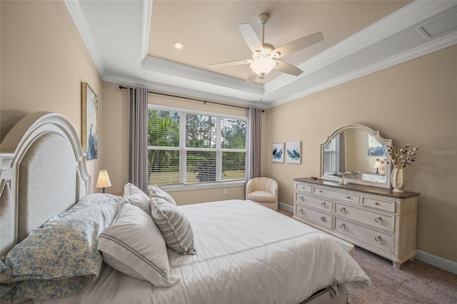 bedroom featuring a raised ceiling, ornamental molding, carpet, and ceiling fan