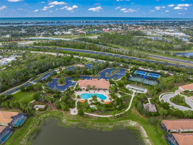 birds eye view of property with a water view