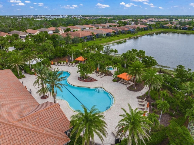 view of swimming pool featuring a patio area and a water view