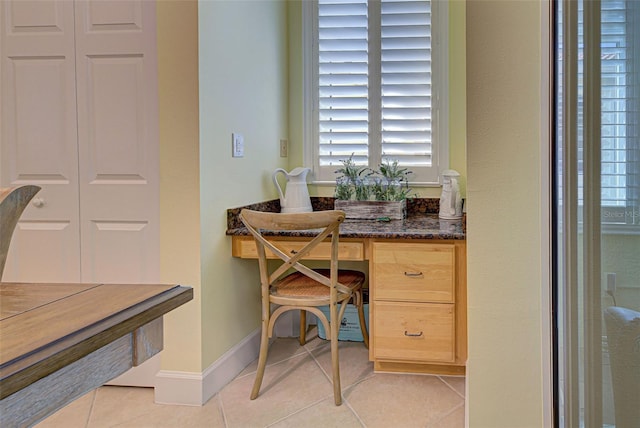 office area featuring light tile patterned flooring