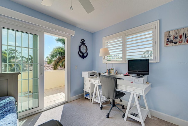 home office with ceiling fan and light colored carpet