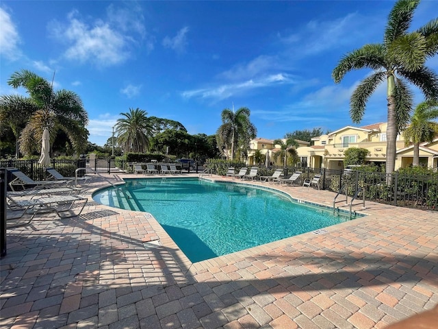 view of swimming pool with a patio