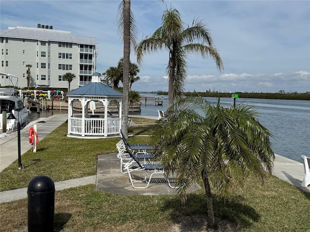 view of home's community featuring a gazebo, a lawn, and a water view