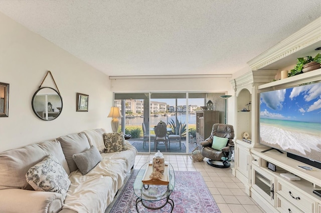 living room with light tile patterned floors and a textured ceiling