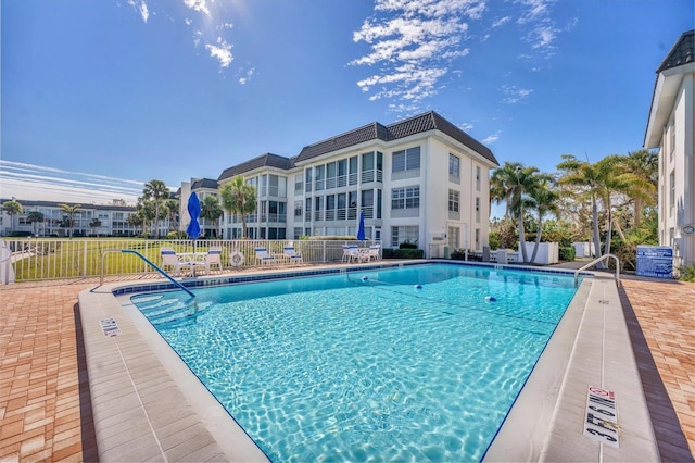 view of swimming pool with a patio