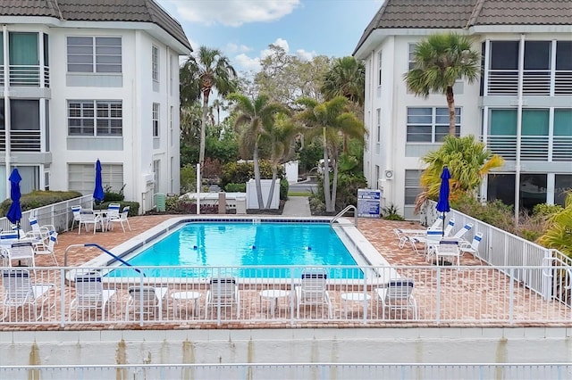 view of swimming pool with a patio