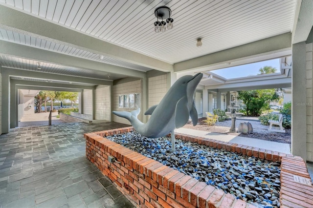 exterior space featuring beamed ceiling