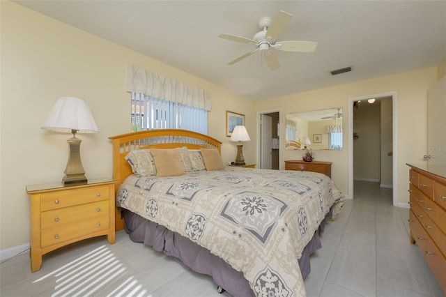 tiled bedroom with ceiling fan