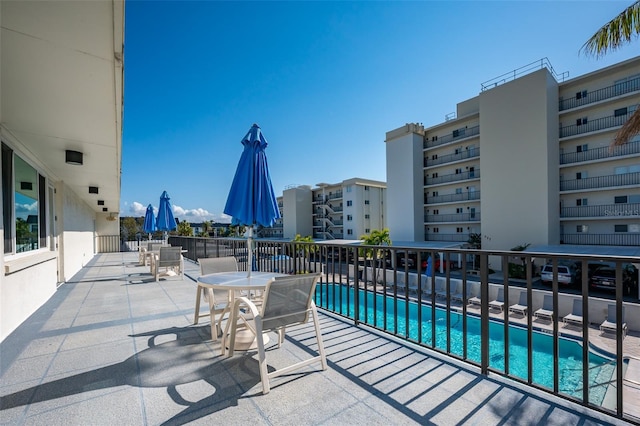 view of patio featuring a community pool