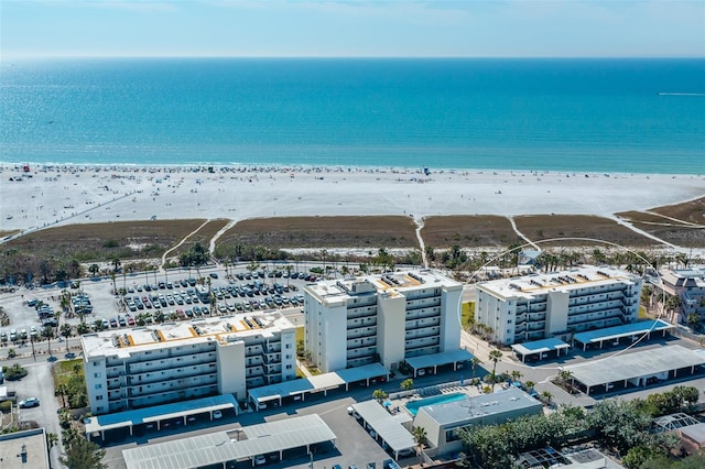 aerial view with a water view and a view of the beach