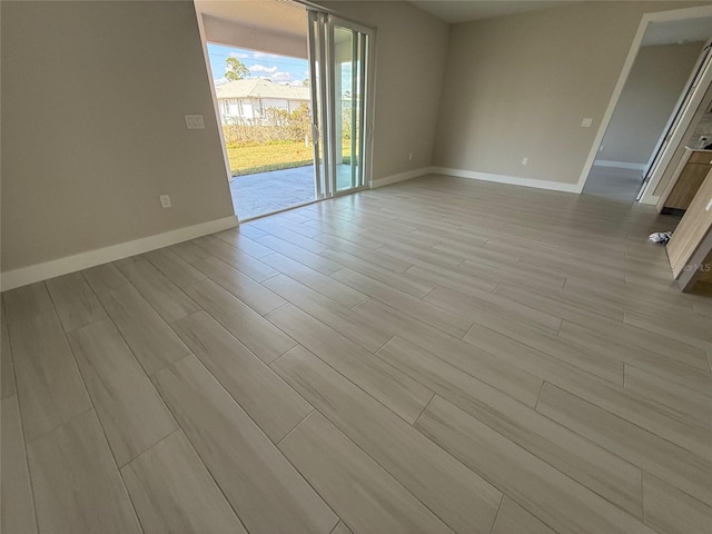 empty room with light hardwood / wood-style flooring