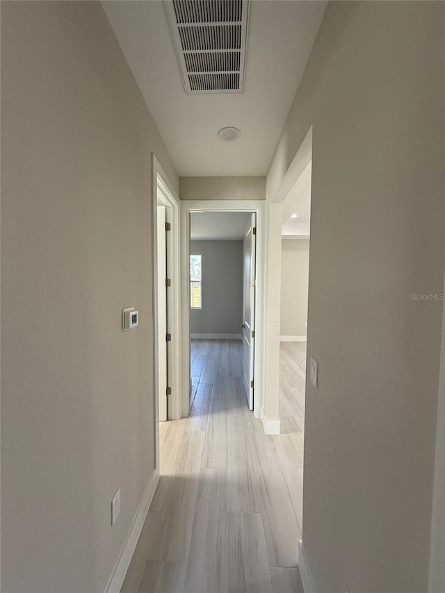 corridor featuring light hardwood / wood-style flooring