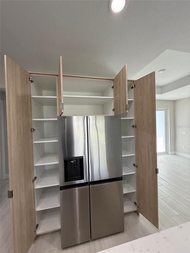 kitchen with stainless steel fridge with ice dispenser