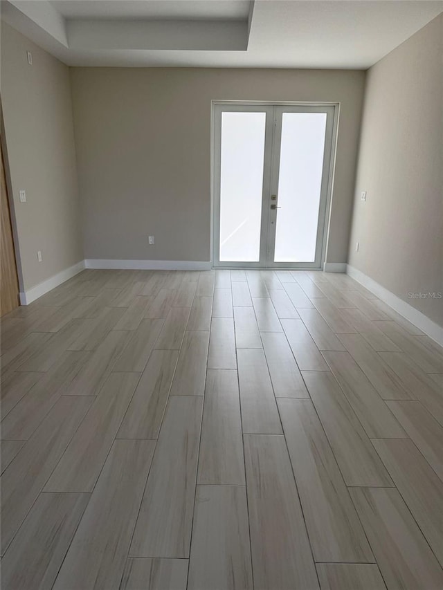 spare room featuring french doors