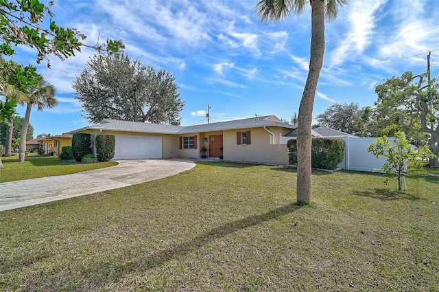 ranch-style house featuring a garage and a front yard