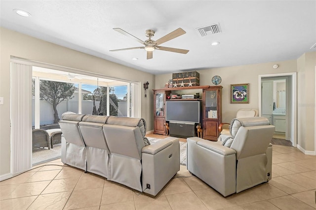 tiled living room featuring ceiling fan