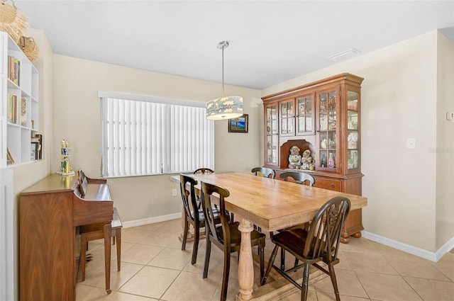 dining area featuring light tile patterned floors