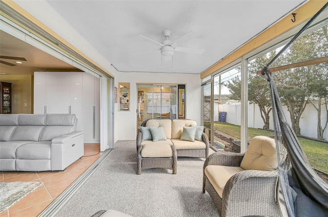 sunroom featuring ceiling fan