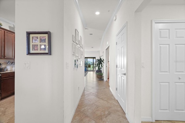 hallway featuring crown molding