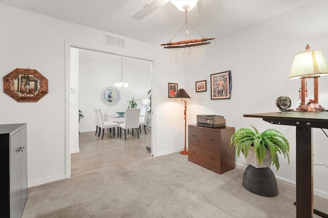 corridor featuring an inviting chandelier and light colored carpet