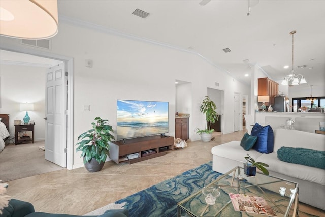 living room featuring vaulted ceiling, ornamental molding, and a chandelier