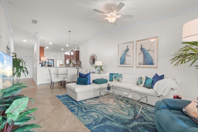 living room featuring ornamental molding and ceiling fan