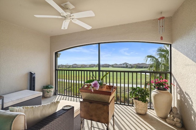 sunroom / solarium with ceiling fan