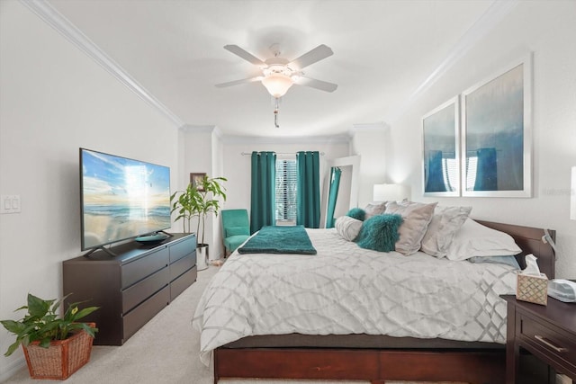 bedroom with crown molding, light colored carpet, and ceiling fan