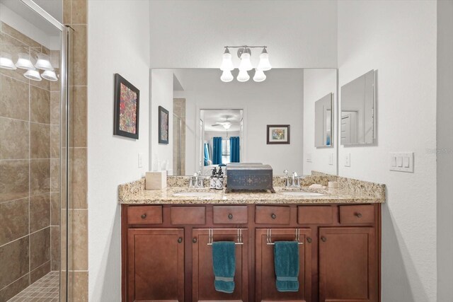 bathroom featuring vanity and a shower with shower door