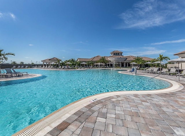 view of swimming pool featuring a gazebo and a patio