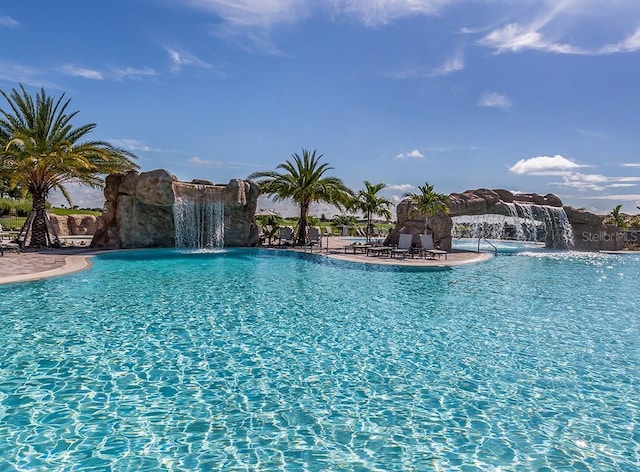 view of swimming pool featuring pool water feature