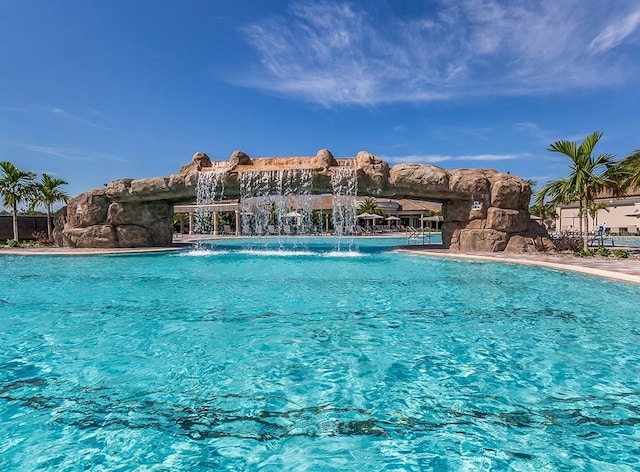 view of pool featuring pool water feature