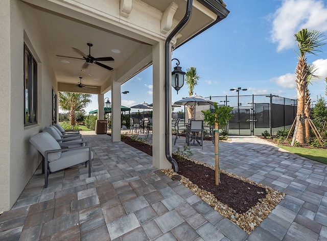 view of patio / terrace featuring a playground and ceiling fan