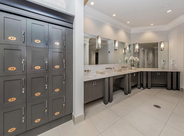 bathroom with vanity, ornamental molding, and tile patterned floors