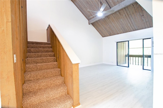 stairway featuring wood-type flooring, high vaulted ceiling, wooden ceiling, beamed ceiling, and ceiling fan