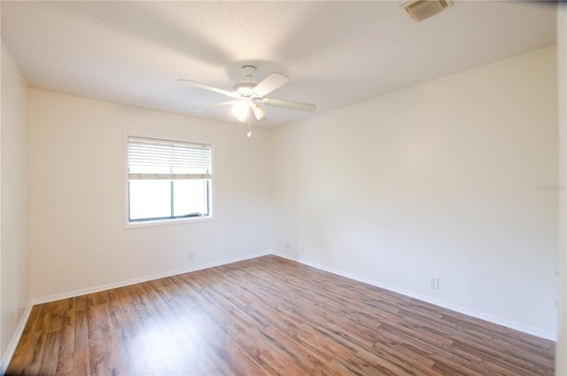 spare room featuring ceiling fan and hardwood / wood-style floors