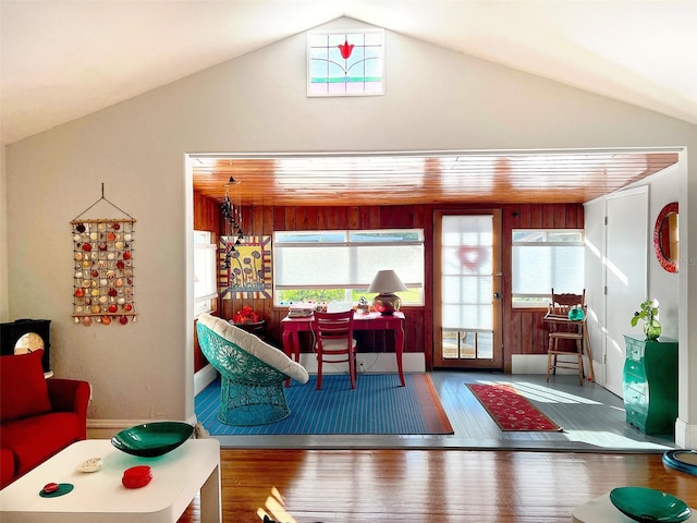 living room featuring hardwood / wood-style flooring and lofted ceiling