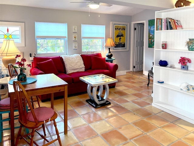 tiled living room featuring ceiling fan