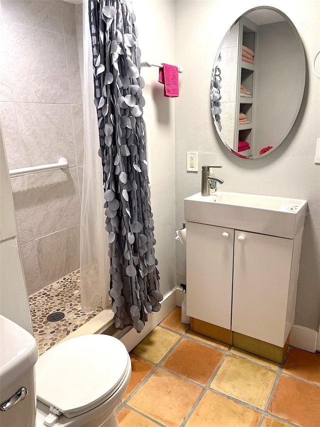 bathroom with vanity, toilet, and a shower with shower curtain