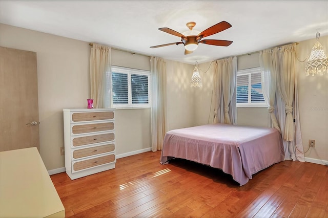 bedroom featuring hardwood / wood-style flooring and ceiling fan