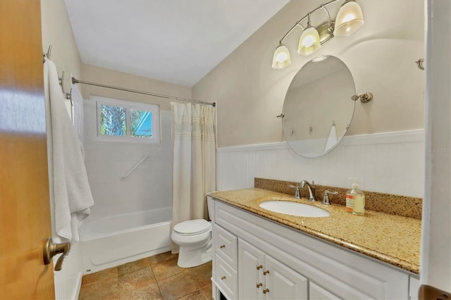 full bathroom with vanity, shower / bath combo, and toilet