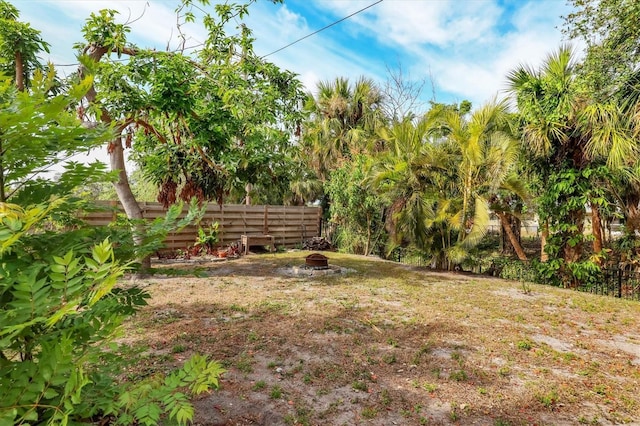 view of yard with an outdoor fire pit