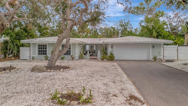 ranch-style home featuring a garage