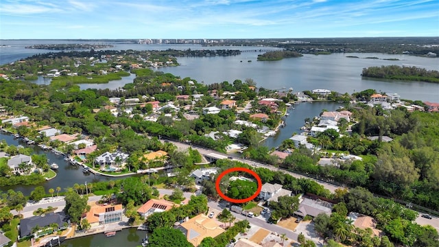 birds eye view of property featuring a water view