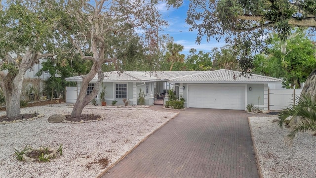 single story home with a garage