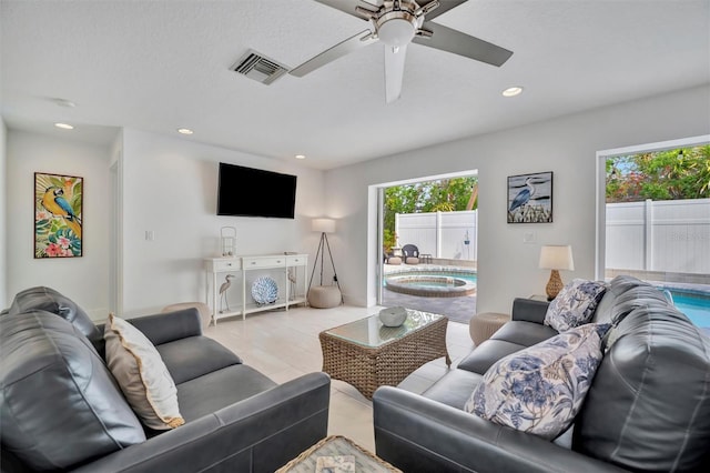 living room featuring ceiling fan