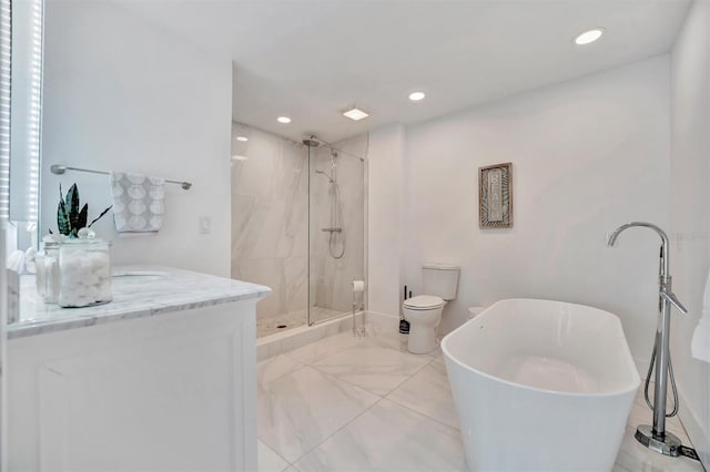 full bathroom featuring toilet, vanity, and shower with separate bathtub