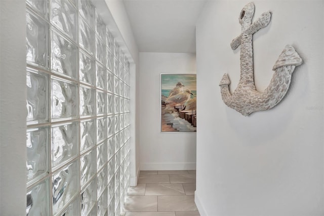 corridor with light tile patterned flooring