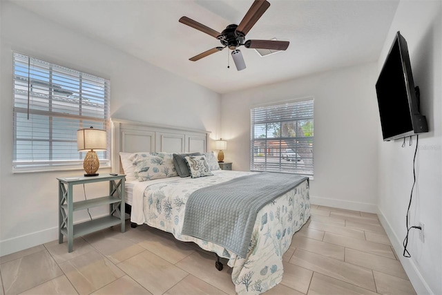 bedroom featuring light tile patterned floors and ceiling fan